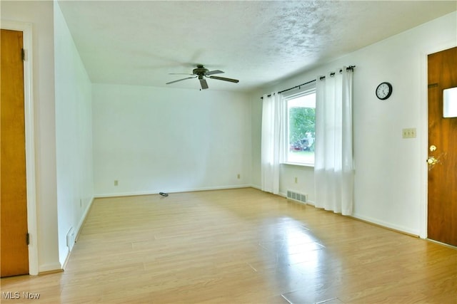 131 Euclid Blvd, Youngstown, OH 44505 - unfurnished living room with a ceiling fan and light wood-style floors