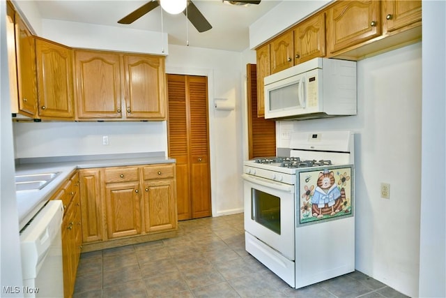 131 Euclid Blvd, Youngstown, OH 44505 - kitchen featuring white appliances, a ceiling fan, light countertops, light tile patterned floors, and brown cabinets