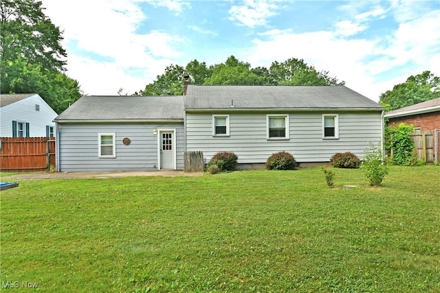 131 Euclid Blvd, Youngstown, OH 44505 - rear view of house with a patio and a chimney