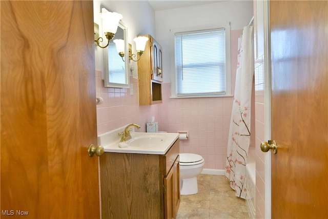 131 Euclid Blvd, Youngstown, OH 44505 - bathroom with vanity, tile walls, tile patterned flooring, and shower / bath combo