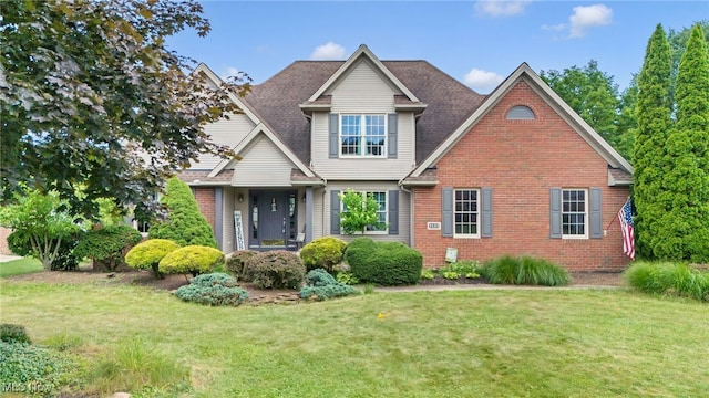 1133 S Azalea Blvd, Barberton, OH 44203 - view of front of property with brick siding and a front lawn