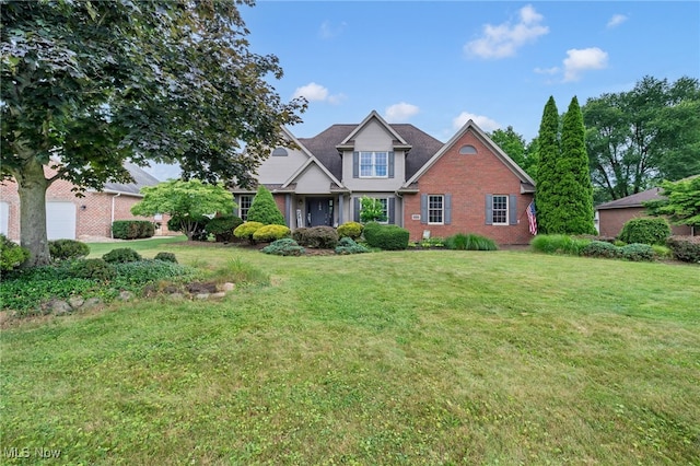 1133 S Azalea Blvd, Barberton, OH 44203 - view of front of house with brick siding and a front lawn