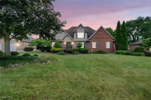 1133 S Azalea Blvd, Barberton, OH 44203 - view of front of house with brick siding and a front lawn