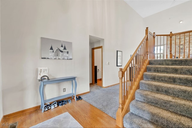 1133 S Azalea Blvd, Barberton, OH 44203 - stairs with wood finished floors and a high ceiling