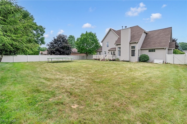 1133 S Azalea Blvd, Barberton, OH 44203 - fenced backyard featuring a trampoline