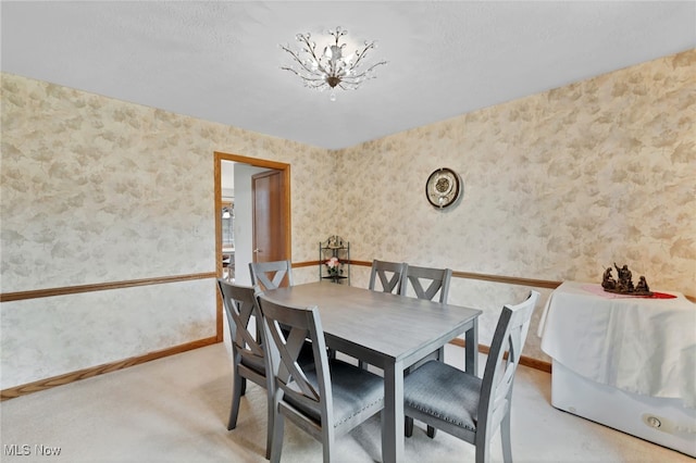 1133 S Azalea Blvd, Barberton, OH 44203 - dining space featuring wallpapered walls and light colored carpet
