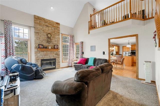 1133 S Azalea Blvd, Barberton, OH 44203 - carpeted living area with high vaulted ceiling and a fireplace