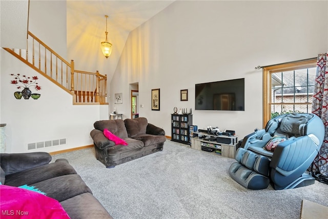 1133 S Azalea Blvd, Barberton, OH 44203 - living area featuring carpet, a towering ceiling, and stairs