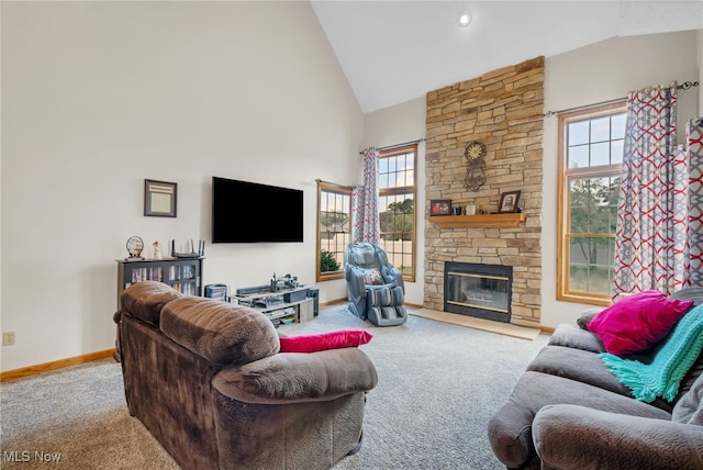 1133 S Azalea Blvd, Barberton, OH 44203 - living area featuring carpet floors, high vaulted ceiling, and a stone fireplace