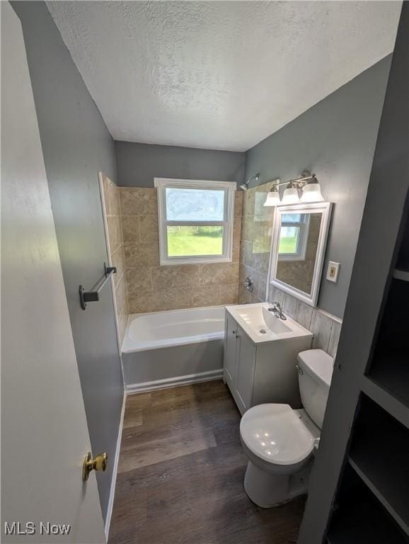 1240 W 21st St, Lorain, OH 44052 - bathroom with a textured ceiling, vanity, and wood finished floors