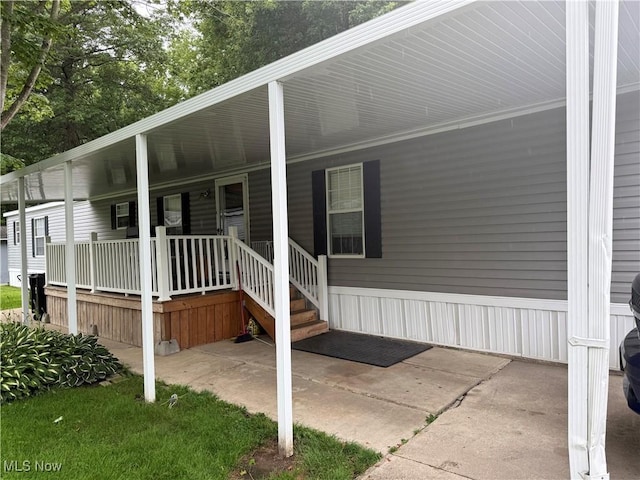 3925 N Ridge E, Ashtabula, OH 44004 - property entrance with a carport and covered porch