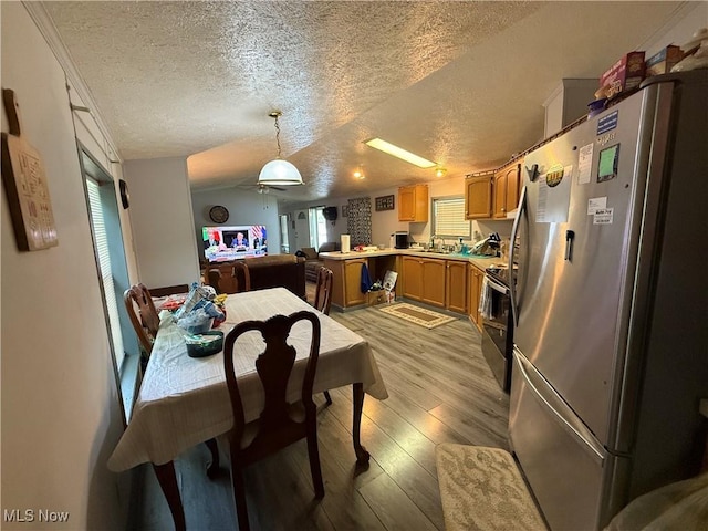 3925 N Ridge E, Ashtabula, OH 44004 - dining area with a textured ceiling, light wood-style flooring, plenty of natural light, and a ceiling fan