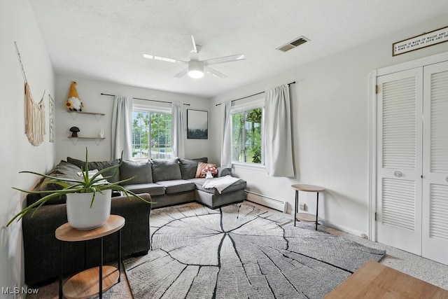 1624 Krumroy Rd, Akron, OH 44306 - living room featuring baseboard heating and a ceiling fan