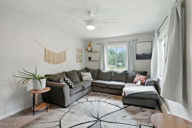 1624 Krumroy Rd, Akron, OH 44306 - carpeted living area with a baseboard heating unit and a ceiling fan