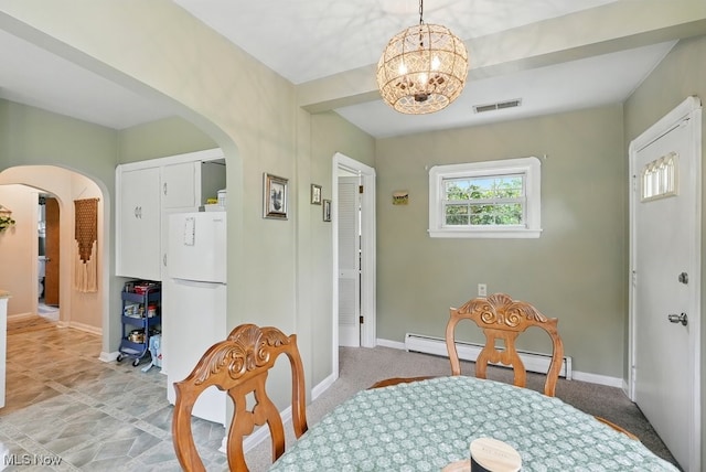 1624 Krumroy Rd, Akron, OH 44306 - dining room with a baseboard heating unit, arched walkways, and a chandelier
