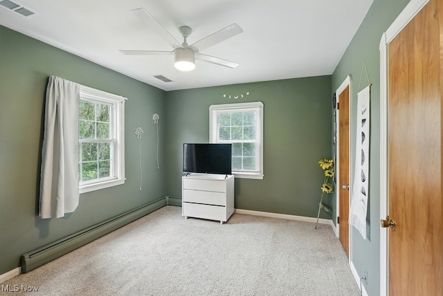 1624 Krumroy Rd, Akron, OH 44306 - unfurnished bedroom with baseboard heating, carpet floors, and ceiling fan