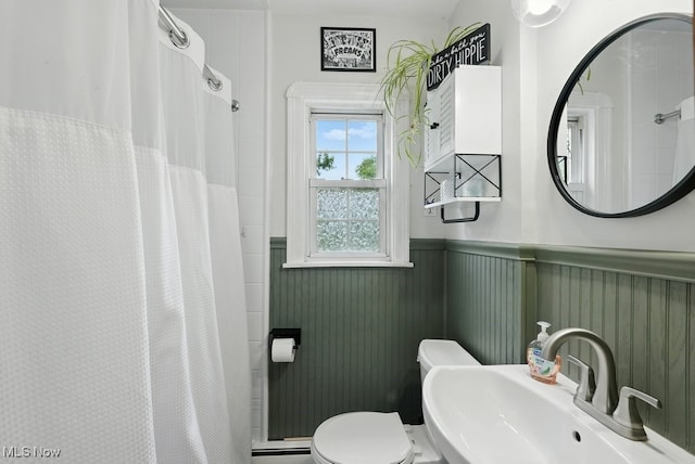 1624 Krumroy Rd, Akron, OH 44306 - bathroom featuring wainscoting and a shower with shower curtain