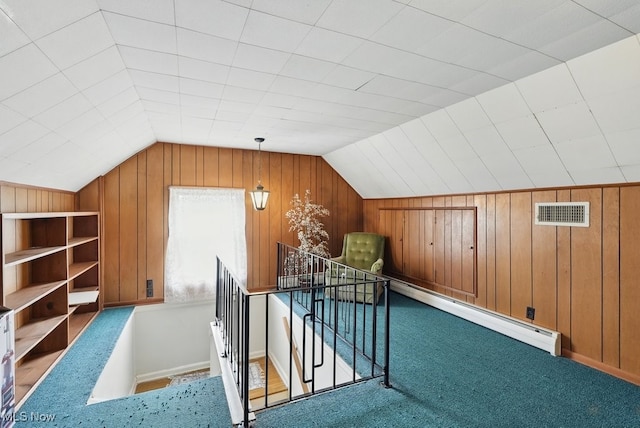 1624 Krumroy Rd, Akron, OH 44306 - additional living space featuring lofted ceiling, baseboard heating, wood walls, and carpet flooring