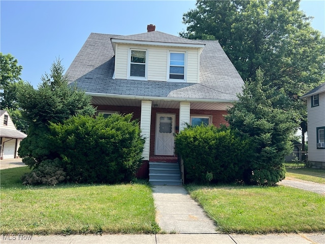 1365 Craneing Rd, Wickliffe, OH 44092 - view of front of property featuring a front lawn, a porch, and roof with shingles