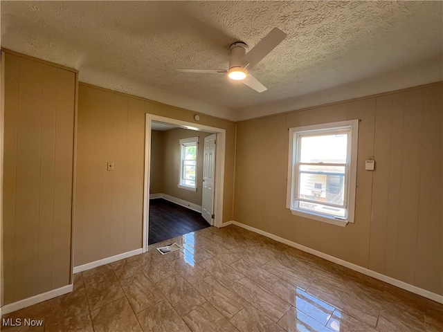 1365 Craneing Rd, Wickliffe, OH 44092 - spare room with a ceiling fan and a textured ceiling
