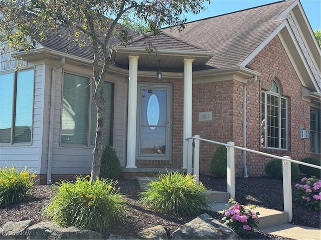 1204 Saint Abigail St SW, Hartville, OH 44632 - view of exterior entry with roof with shingles