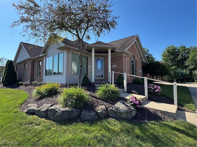 1204 Saint Abigail St SW, Hartville, OH 44632 - ranch-style house with brick siding and a front yard