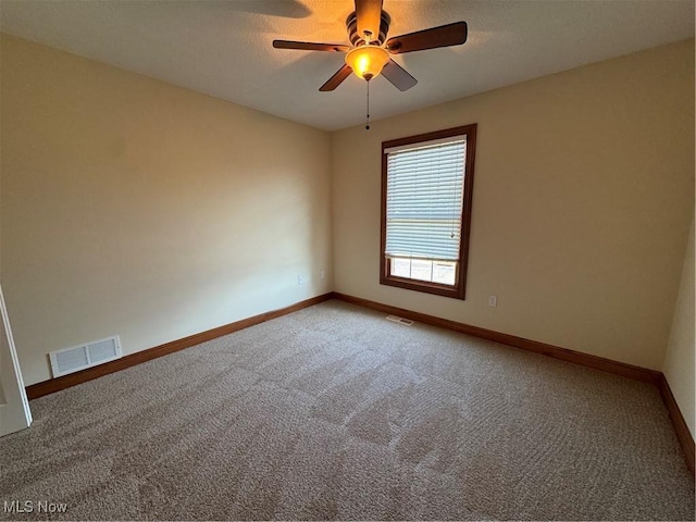 1204 Saint Abigail St SW, Hartville, OH 44632 - carpeted spare room with baseboards and ceiling fan