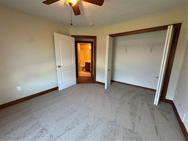1204 Saint Abigail St SW, Hartville, OH 44632 - unfurnished bedroom featuring carpet floors, a closet, and ceiling fan