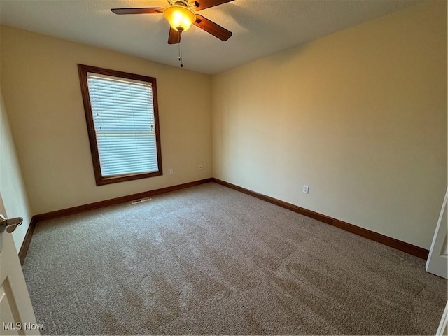 1204 Saint Abigail St SW, Hartville, OH 44632 - carpeted empty room with ceiling fan and baseboards