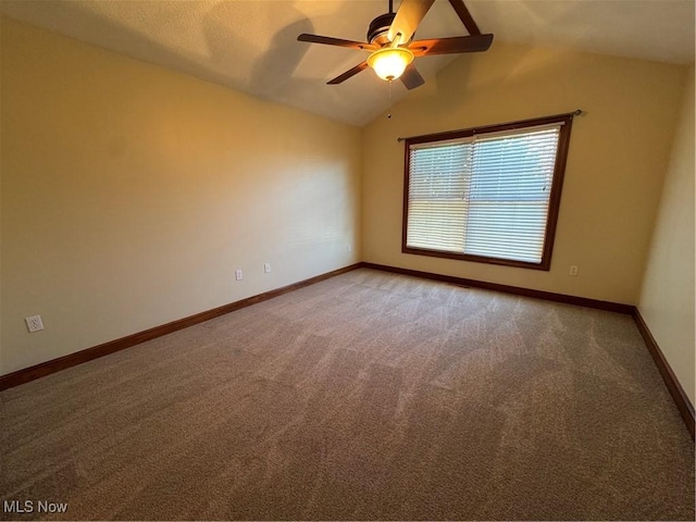 1204 Saint Abigail St SW, Hartville, OH 44632 - empty room with carpet, vaulted ceiling, and a ceiling fan
