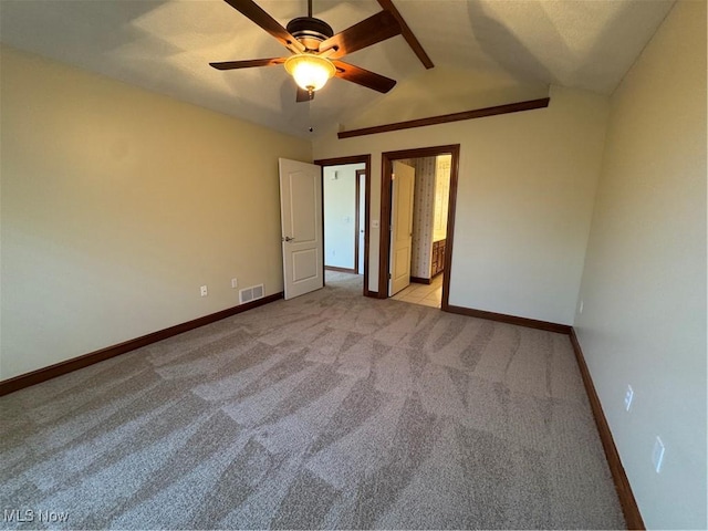 1204 Saint Abigail St SW, Hartville, OH 44632 - unfurnished bedroom with light carpet, ensuite bath, and a ceiling fan