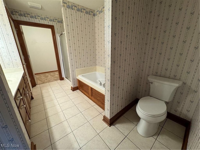 1204 Saint Abigail St SW, Hartville, OH 44632 - full bathroom with tile patterned flooring, a garden tub, a stall shower, wallpapered walls, and vanity