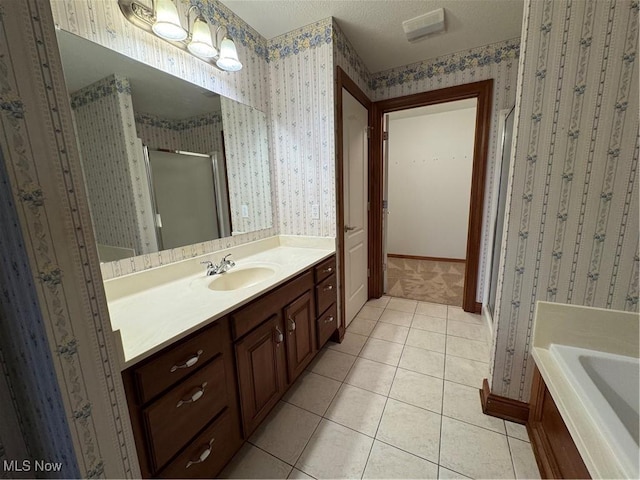 1204 Saint Abigail St SW, Hartville, OH 44632 - bathroom with a stall shower, wallpapered walls, vanity, tile patterned floors, and a bath