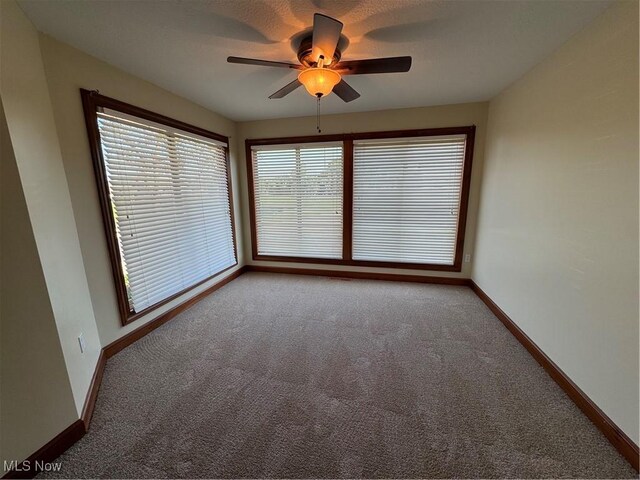 1204 Saint Abigail St SW, Hartville, OH 44632 - spare room with carpet and a ceiling fan
