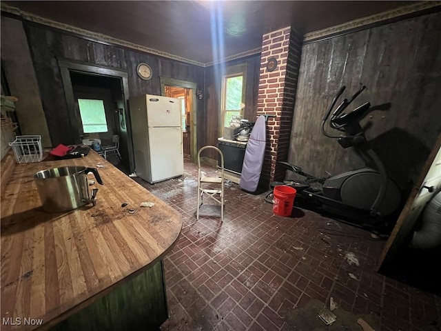 1529 Stark Ave SW, Canton, OH 44706 - kitchen with freestanding refrigerator, brick patterned flooring, and butcher block counters