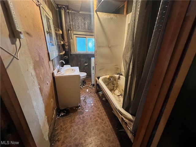1529 Stark Ave SW, Canton, OH 44706 - bathroom with vanity and shower / bath combo with shower curtain