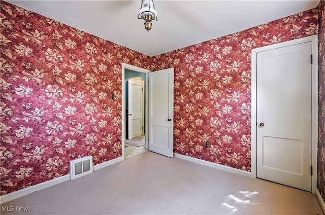 474 W 4th St, Salem, OH 44460 - carpeted empty room with baseboards and wallpapered walls