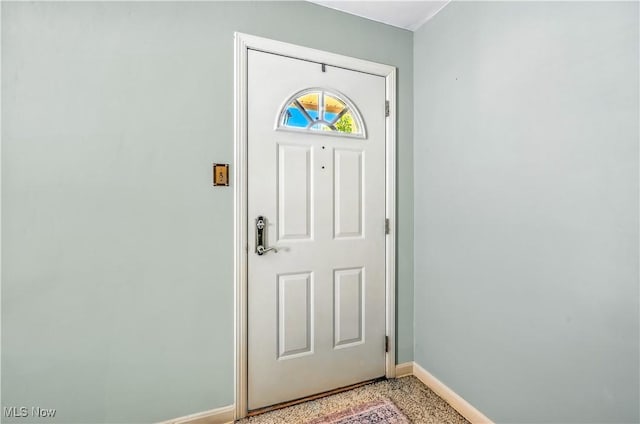 474 W 4th St, Salem, OH 44460 - foyer featuring baseboards and dark speckled floor
