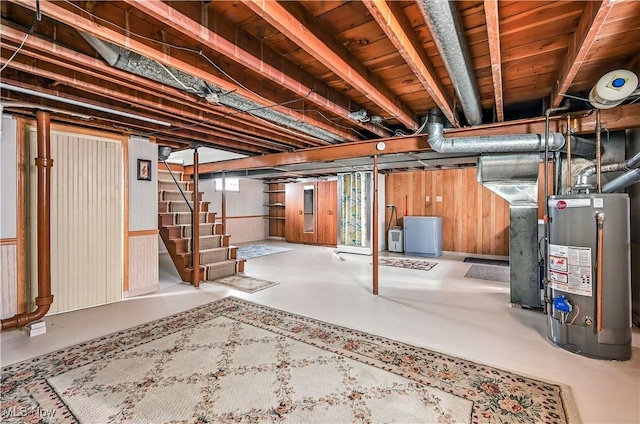 474 W 4th St, Salem, OH 44460 - below grade area with water heater, stairs, wooden walls, and heating unit