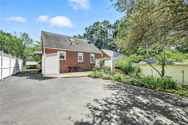 474 W 4th St, Salem, OH 44460 - back of house with brick siding and a patio area