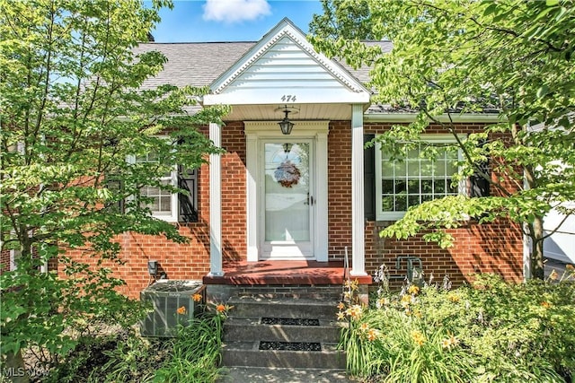 474 W 4th St, Salem, OH 44460 - entrance to property featuring brick siding and a shingled roof