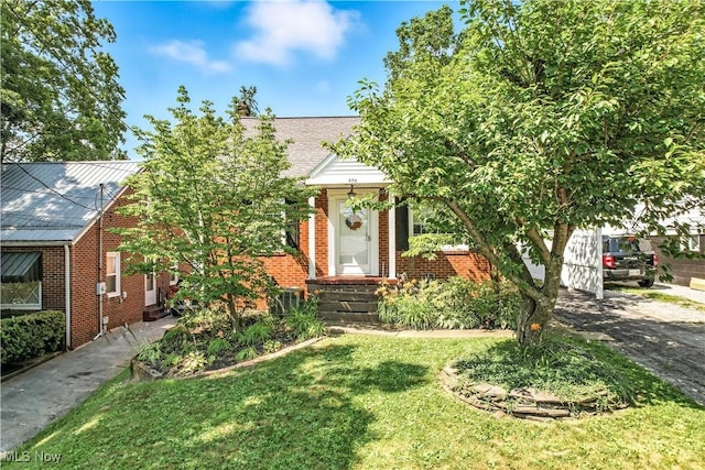 474 W 4th St, Salem, OH 44460 - view of front facade with brick siding and a front yard