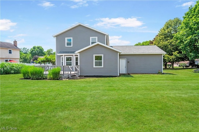 12366 Springwater Ave NW, Uniontown, OH 44685 - back of house featuring a deck and a lawn