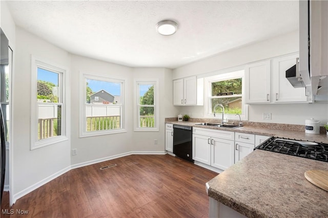 12366 Springwater Ave NW, Uniontown, OH 44685 - kitchen featuring dishwasher, dark wood-style flooring, and plenty of natural light