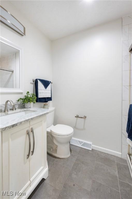 12366 Springwater Ave NW, Uniontown, OH 44685 - bathroom with vanity and an enclosed shower