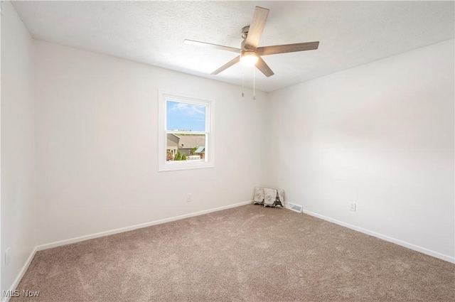 12366 Springwater Ave NW, Uniontown, OH 44685 - empty room featuring carpet and ceiling fan