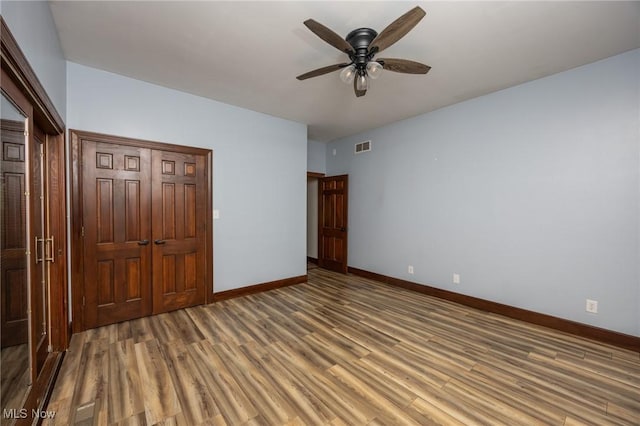 1096 Colegate Dr, Marietta, OH 45750 - unfurnished bedroom with wood finished floors and ceiling fan