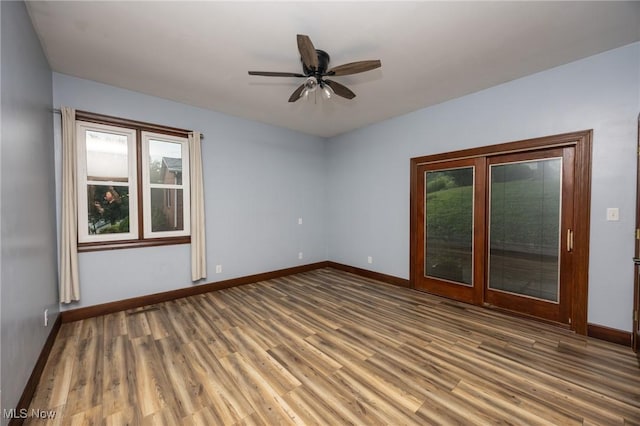 1096 Colegate Dr, Marietta, OH 45750 - spare room with wood finished floors and ceiling fan