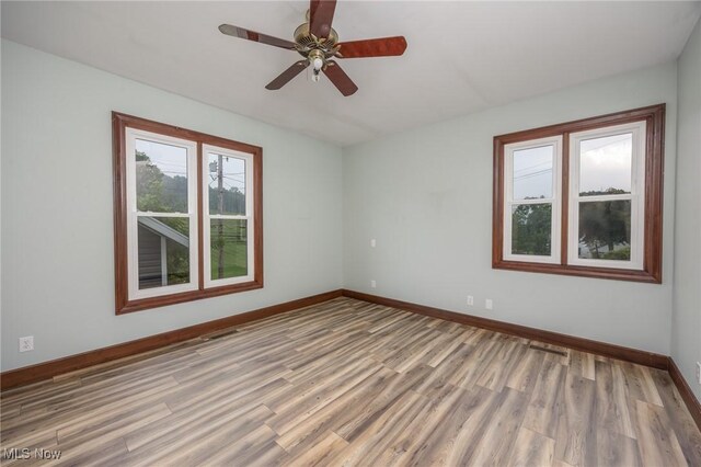 1096 Colegate Dr, Marietta, OH 45750 - spare room with wood finished floors and a ceiling fan