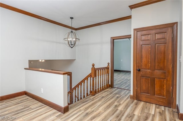 1096 Colegate Dr, Marietta, OH 45750 - entrance foyer with wood finished floors, ornamental molding, and a chandelier